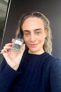 A person holding the The Maker Lover Eau de Parfum